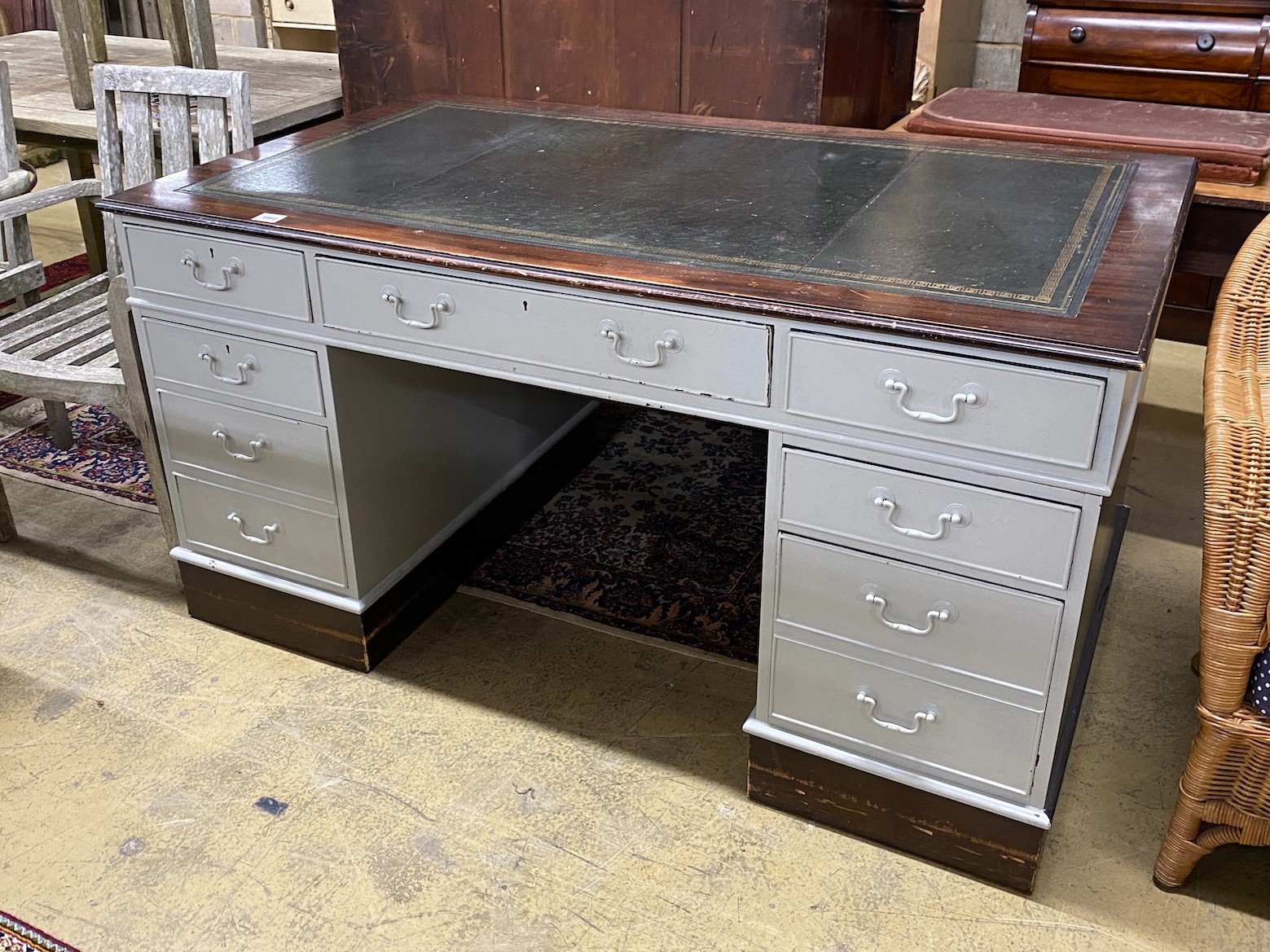 A mid 20th century mahogany pedestal desk, later painted grey, width 152cm, height 90cm